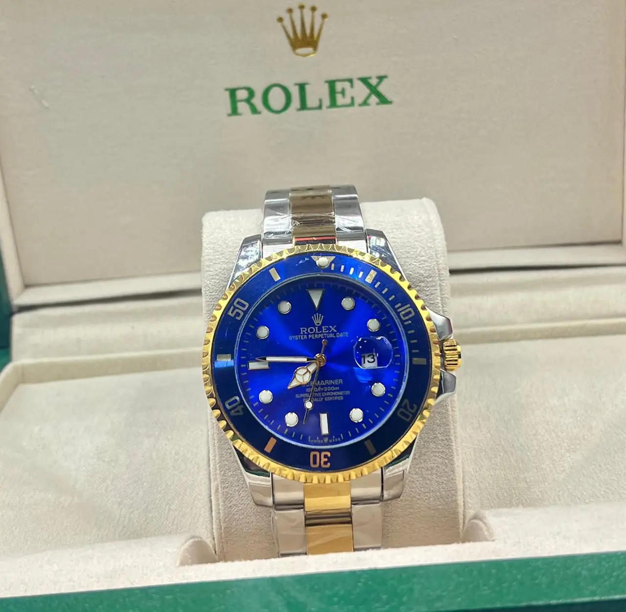 Rolex Submariner Date watch in two-tone yellow gold and Oystersteel with a blue dial and bezel.webp