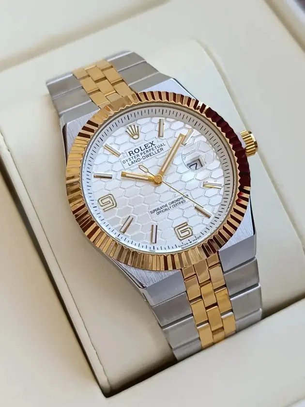 Rolex Oyster Perpetual Land-Dweller watch in Rolesor (steel and yellow gold) with a white honeycomb dial and fluted bezel_3.webp