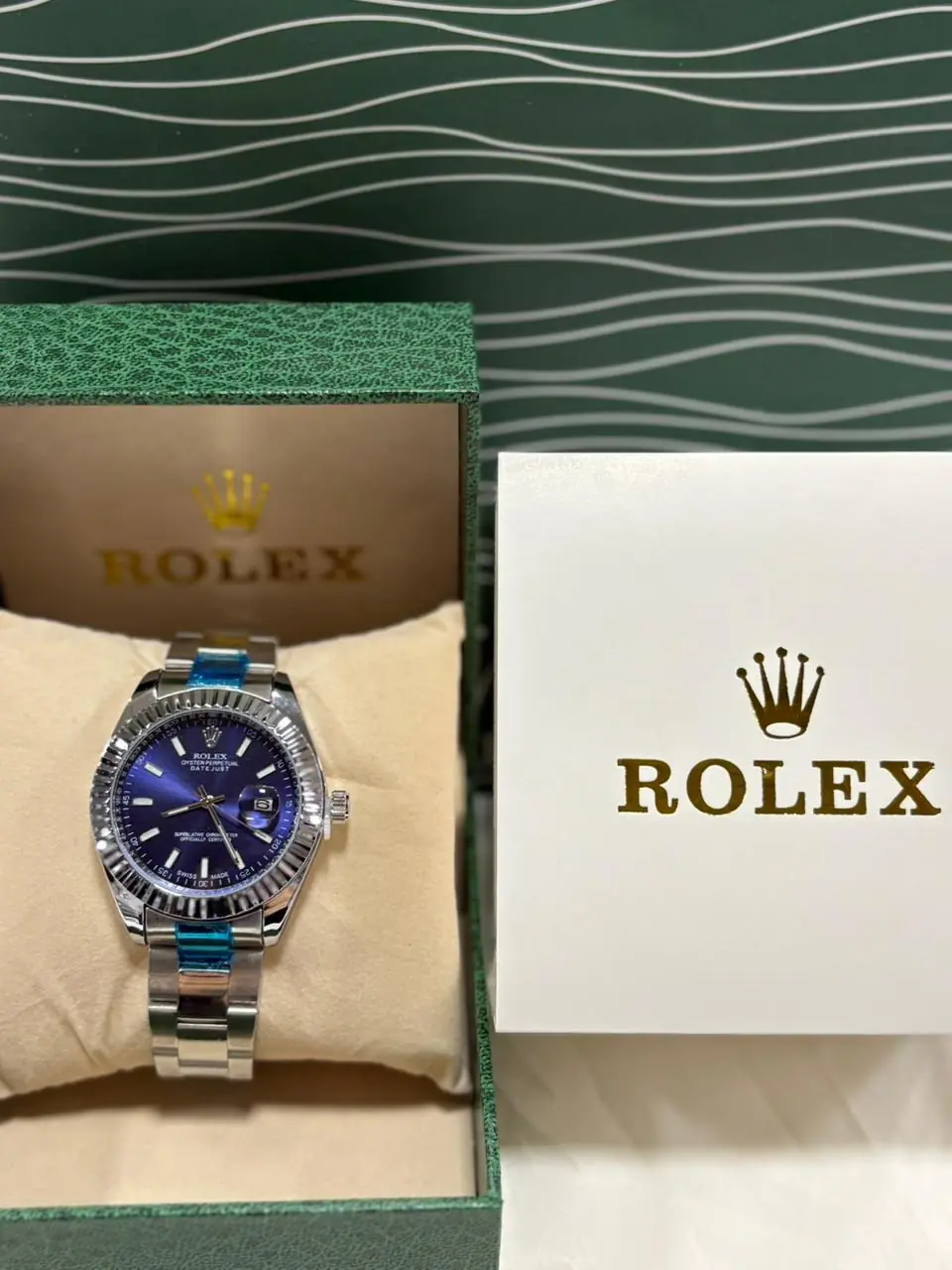 Rolex Datejust watch with a blue dial, fluted bezel, and a bracelet_1.webp