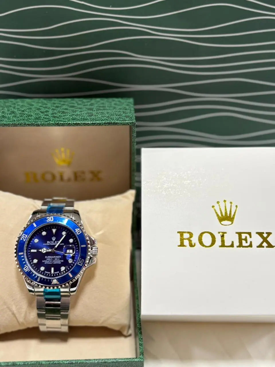 Rolex Oyster Perpetual Submariner Date watch with a blue Cerachrom bezel.webp