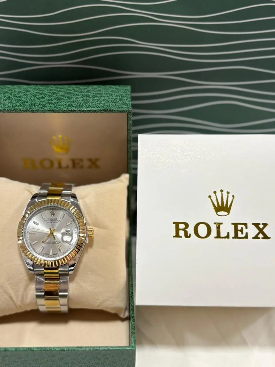 Rolex Datejust 41 watch in Oystersteel and yellow gold with a fluted bezel and a silver baton dial.webp