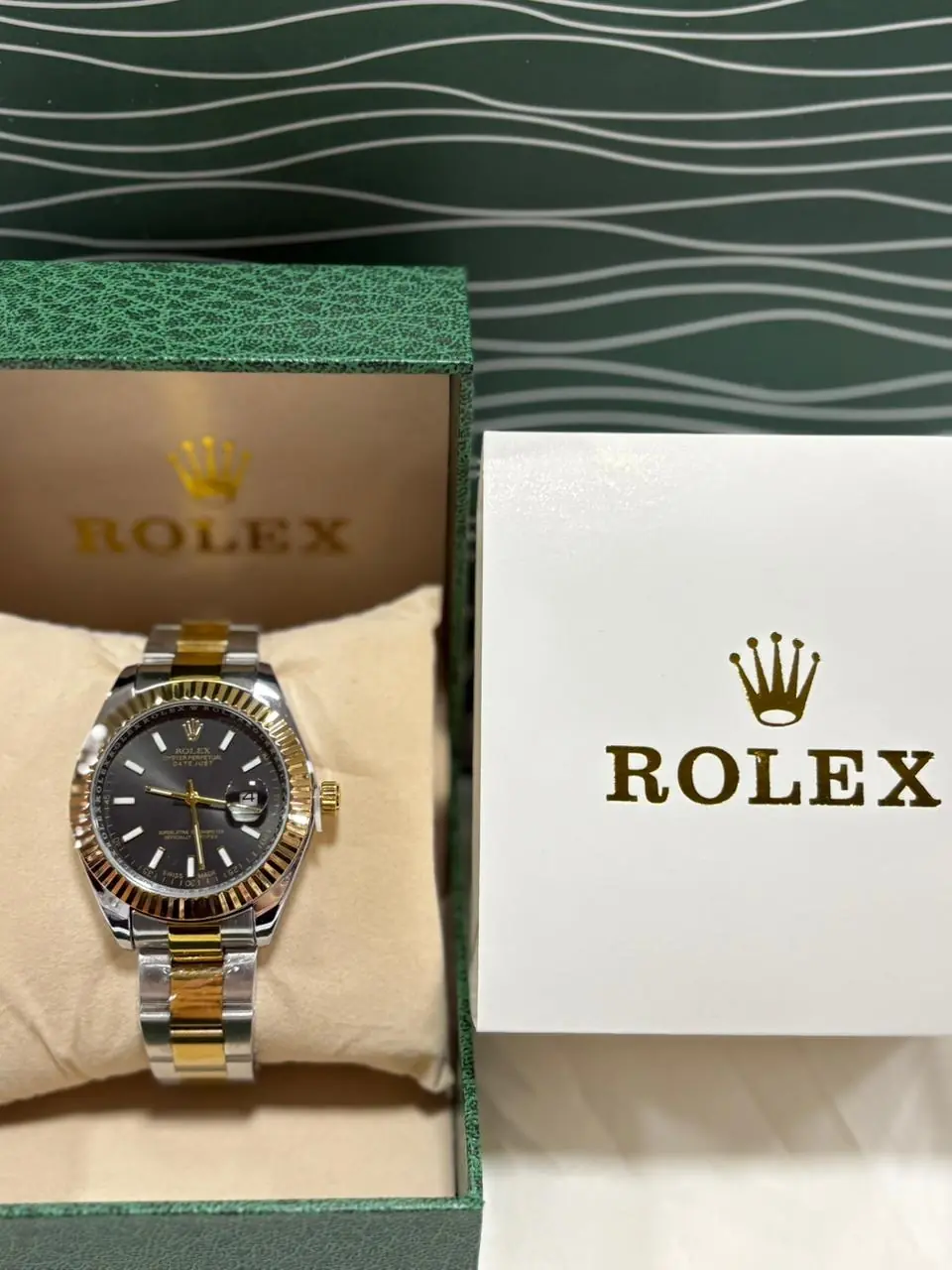 Rolex Datejust 41 with a black dial, fluted bezel, and two-tone steel and yellow gold Oyster bracelet_1.webp