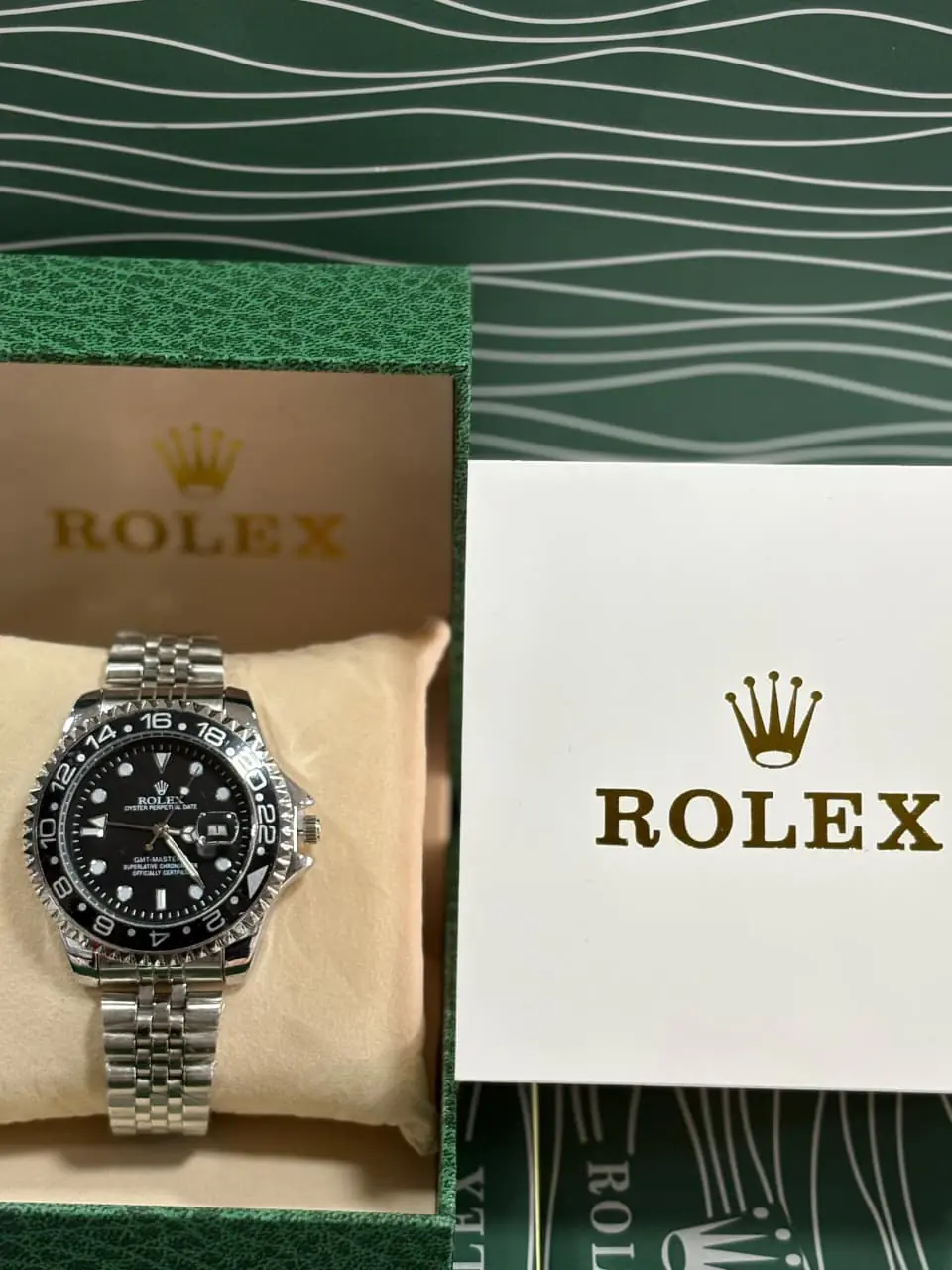 Rolex GMT-Master II watch in Oystersteel with a black dial and Jubilee bracelet.webp