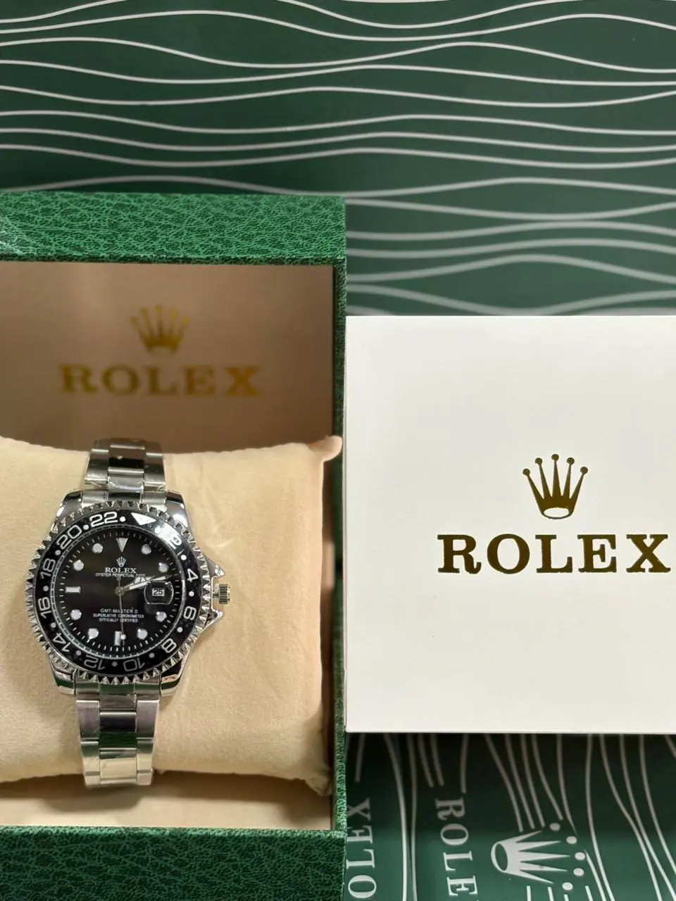 Rolex GMT-Master II watch with a black dial and bezel in a stainless steel Oyster case.webp