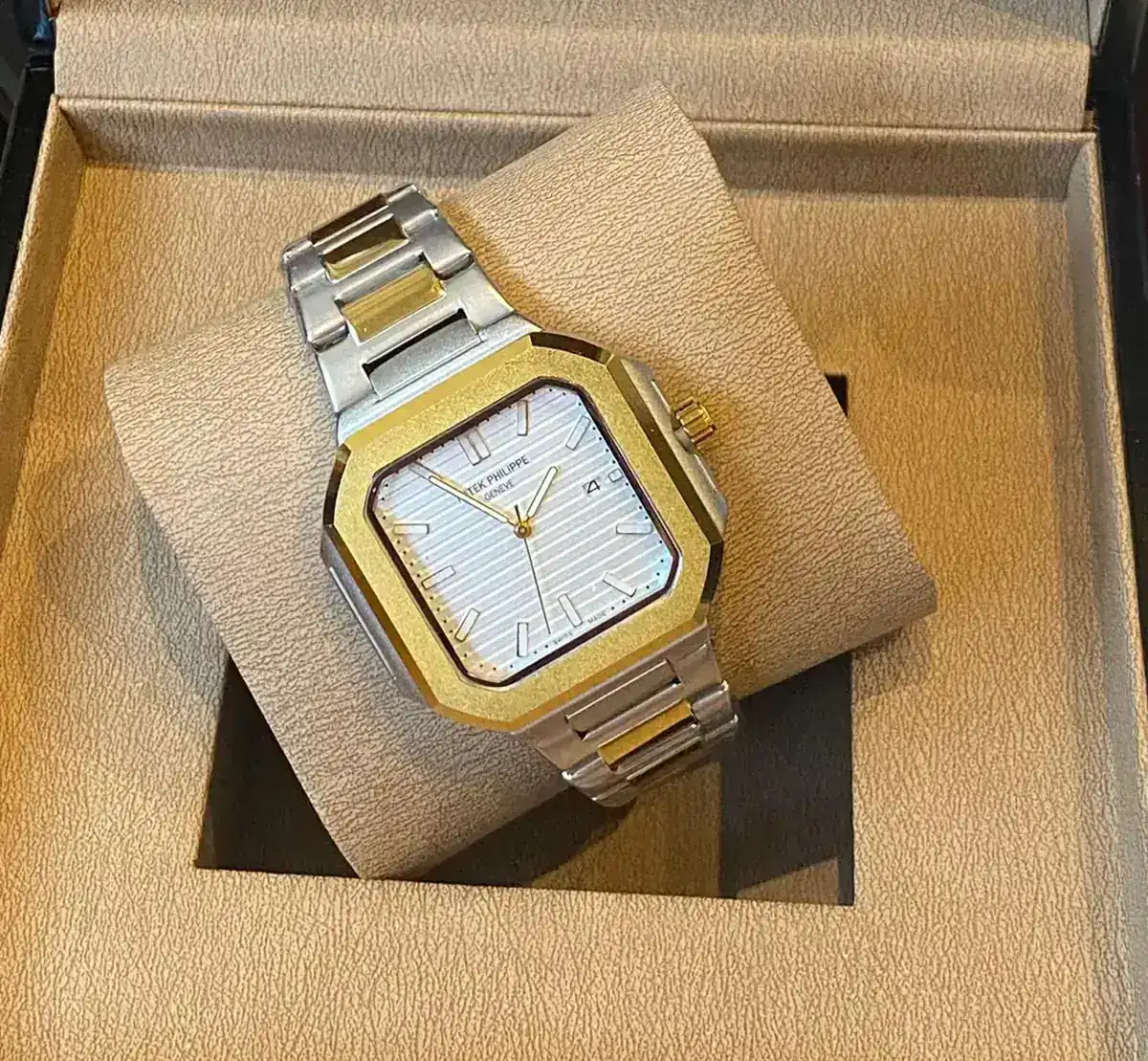 Patek Philippe Cubitus watch, replica model, featuring a two-tone design with a gold-tone bezel and a silver-tone bracelet_1.webp