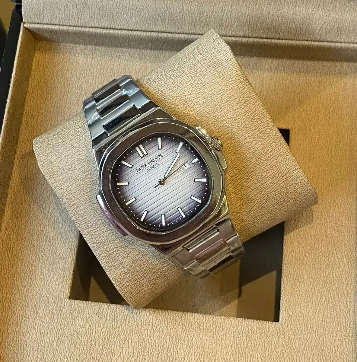 Patek Philippe Nautilus stainless steel watch with a grey dial_3.webp