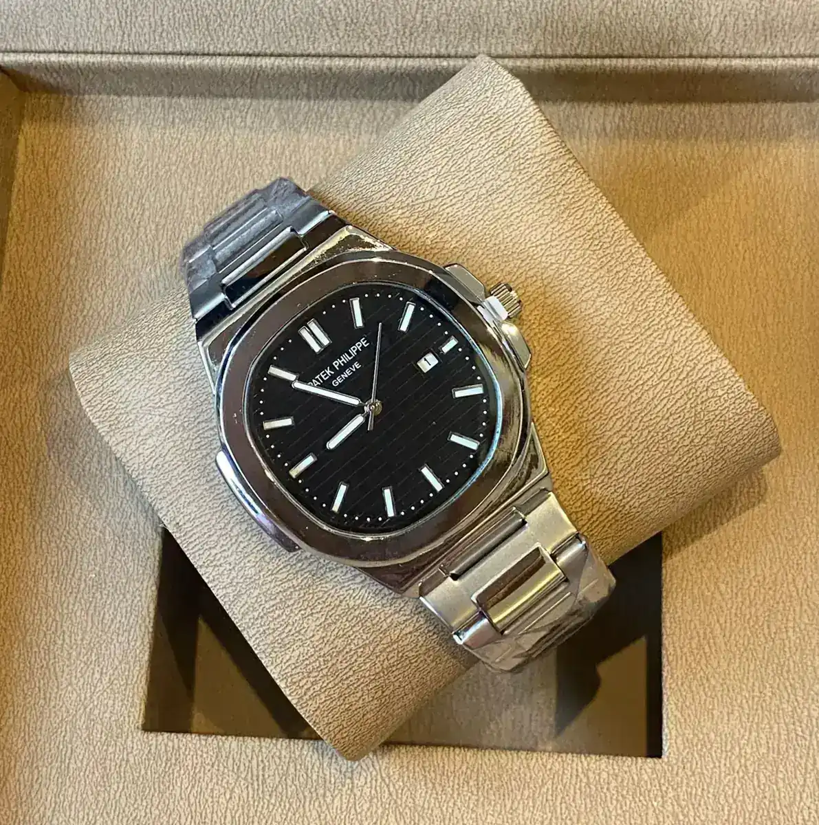 Patek Philippe Nautilus watch with a black dial and stainless steel case and bracelet_2.webp