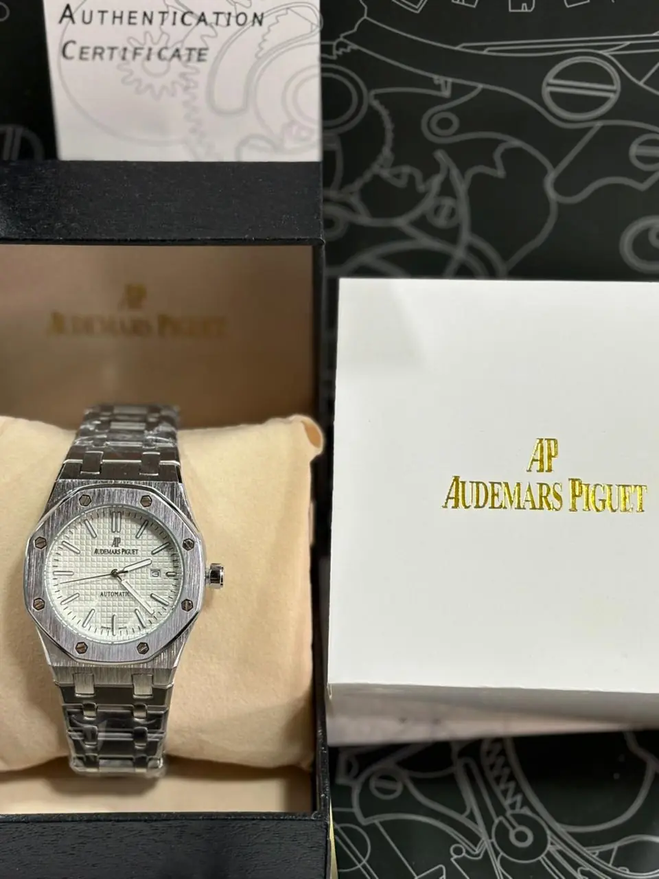 Audemars Piguet Royal Oak silver-toned watch with a white or silver dial and an integrated steel bracelet_1.webp