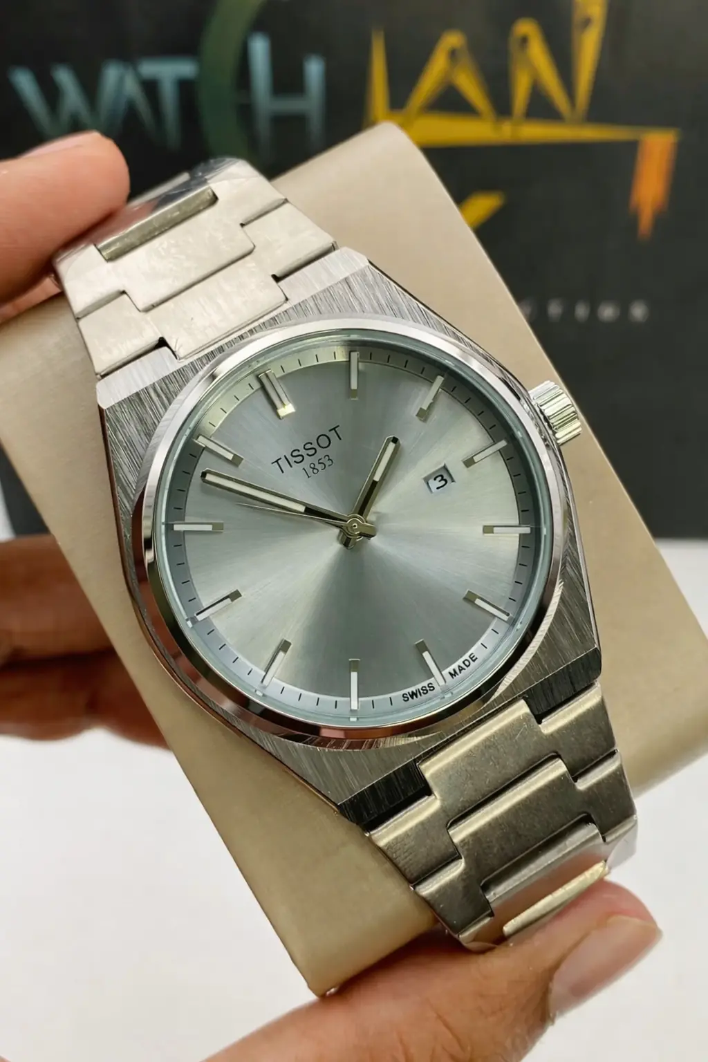 Tissot PRX 1853 quartz watch with a silver dial and stainless steel integrated bracelet_3.webp