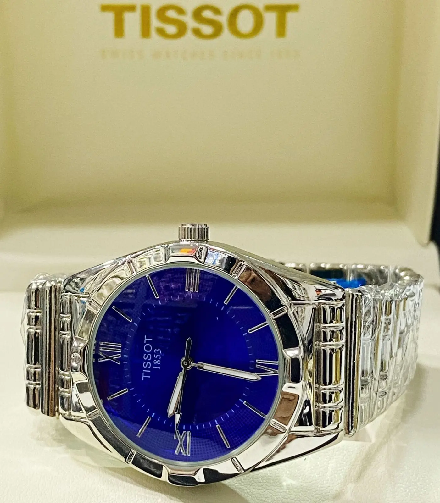 Tissot PR 100 watch with a blue dial and a stainless steel bracelet_2.webp