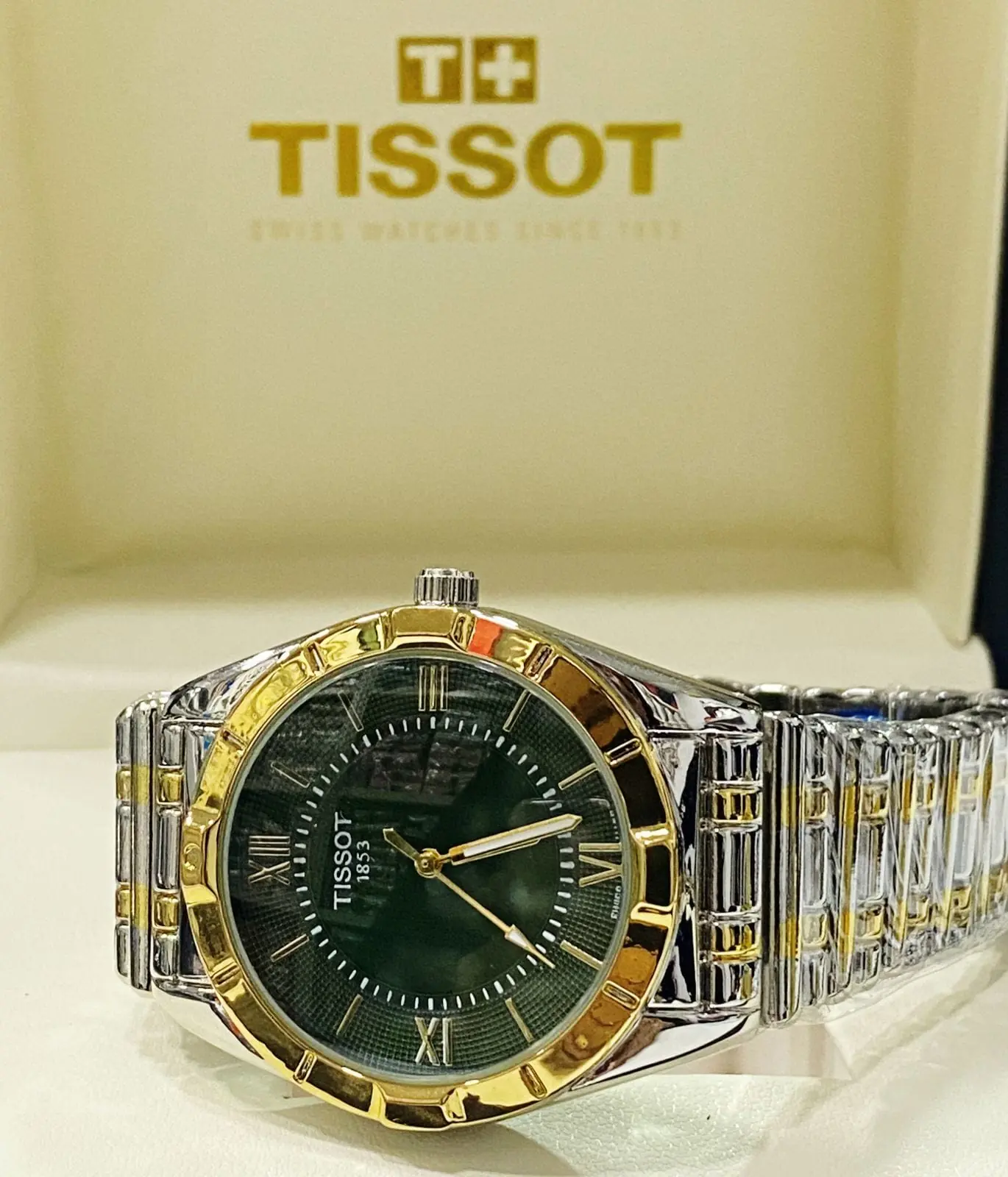 Tissot watch with a green dial and a two-tone gold bracelet_2.webp