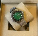 Patek Philippe Nautilus watch with a green dial and stainless steel case and bracelet