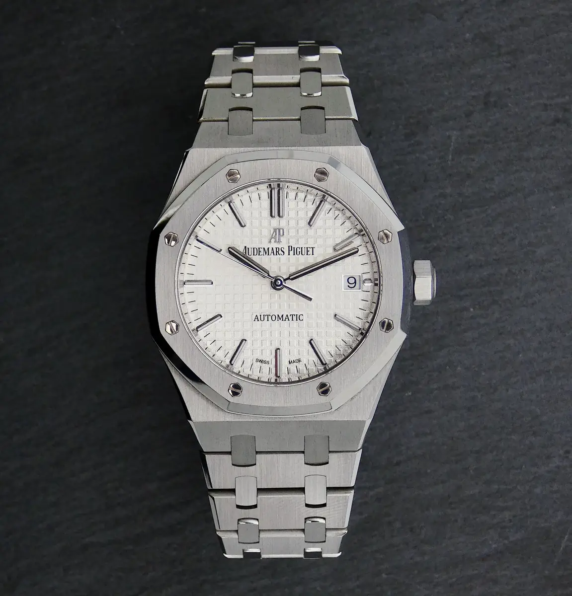 Audemars Piguet Royal Oak silver-toned watch with a white or silver dial and an integrated steel bracelet