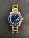Rolex Submariner Date watch in 18k yellow gold with a blue dial