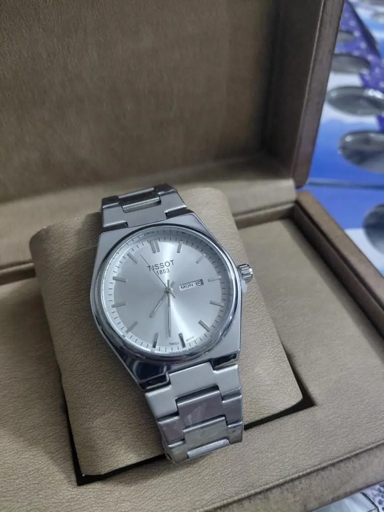 Tissot PRX 1853 quartz watch with a silver dial and stainless steel integrated bracelet