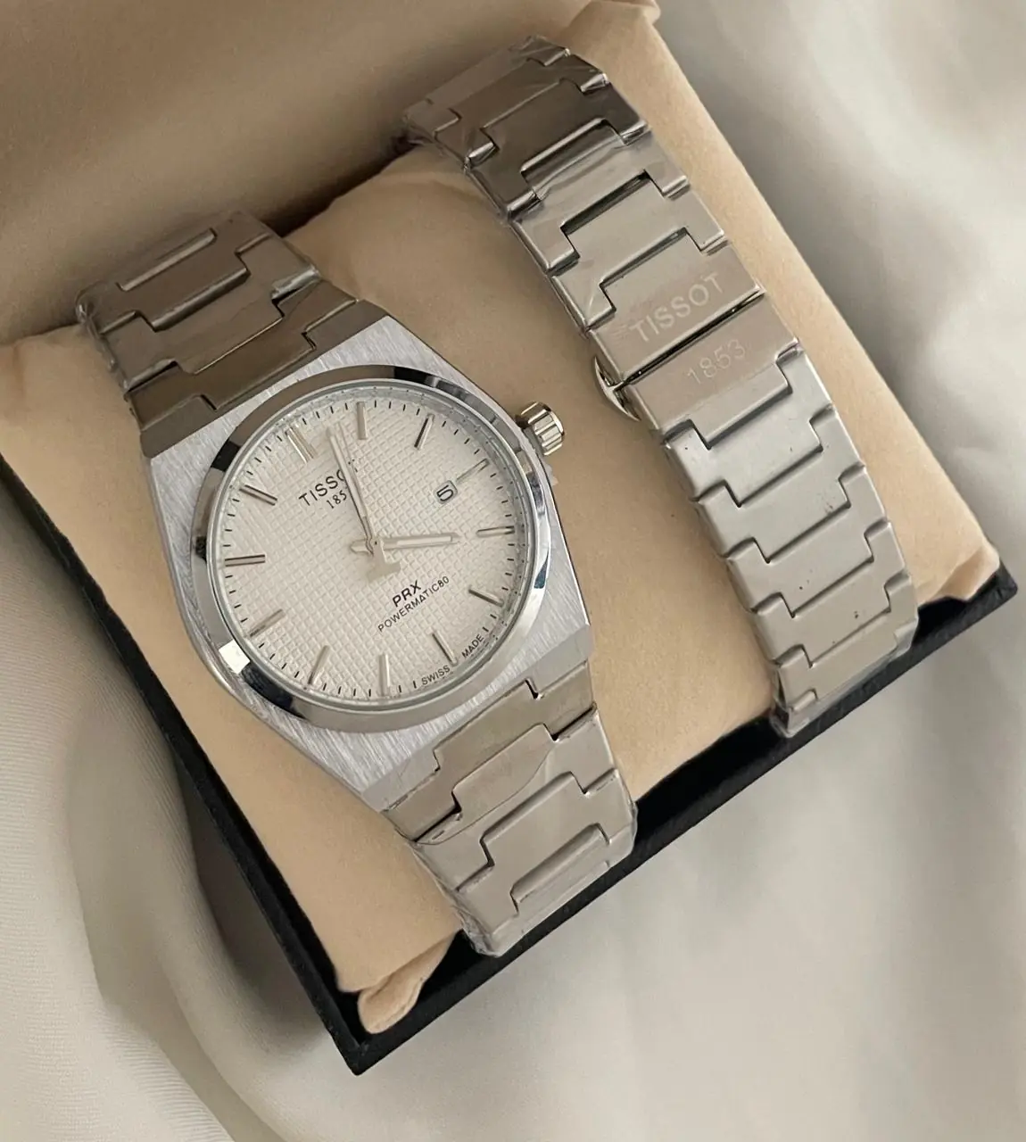 Tissot PRX 35mm Powermatic 80 watch with a white dial and a stainless steel bracelet
