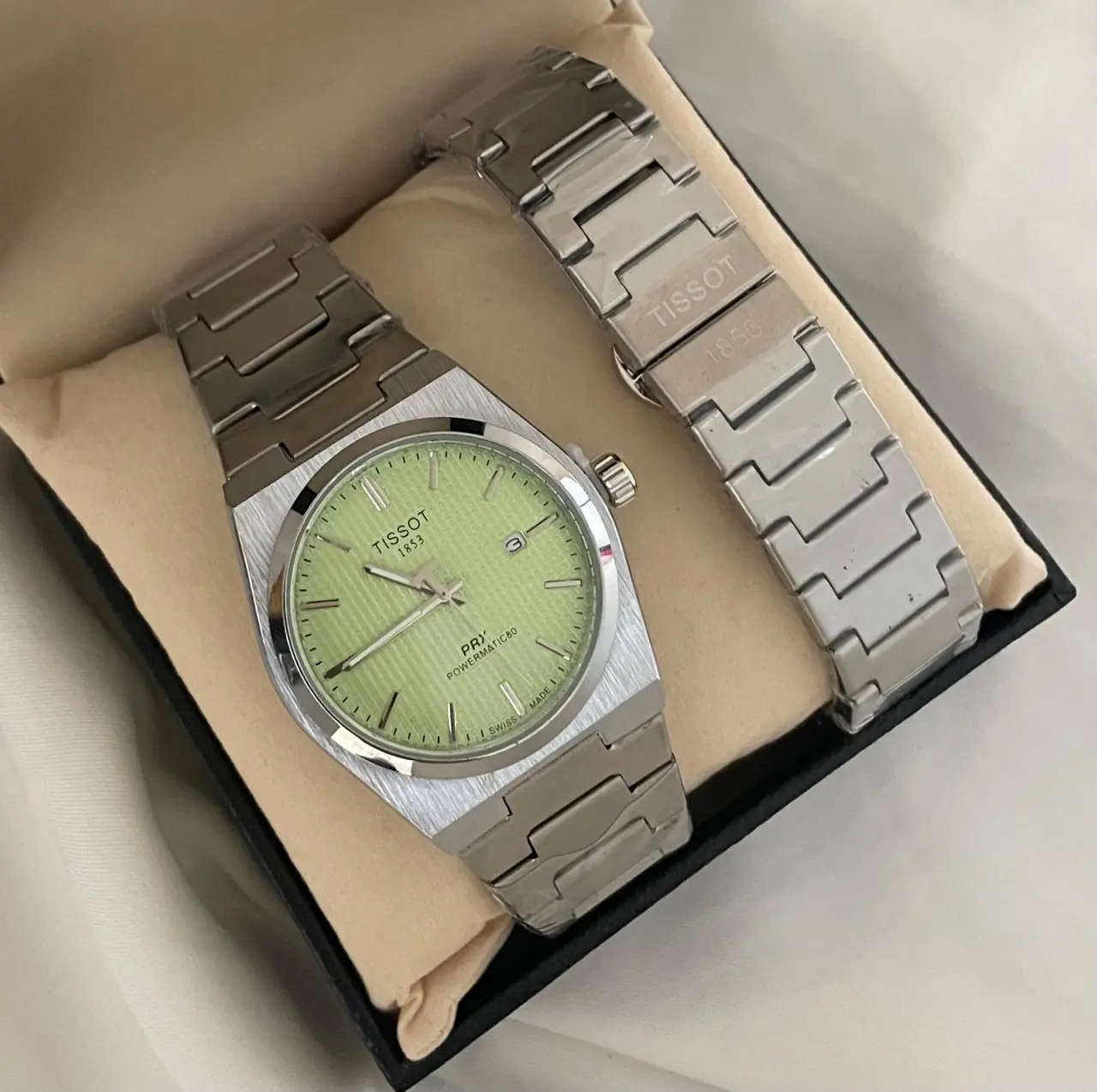 Tissot PRX Powermatic 80 40mm stainless steel case with stainless steel bracelet and a mint green dial