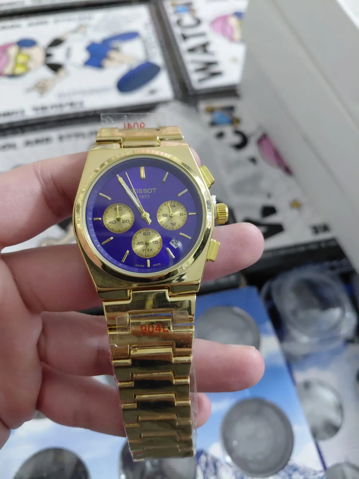 Tissot PRX Chronograph gold-tone watch with a blue dial