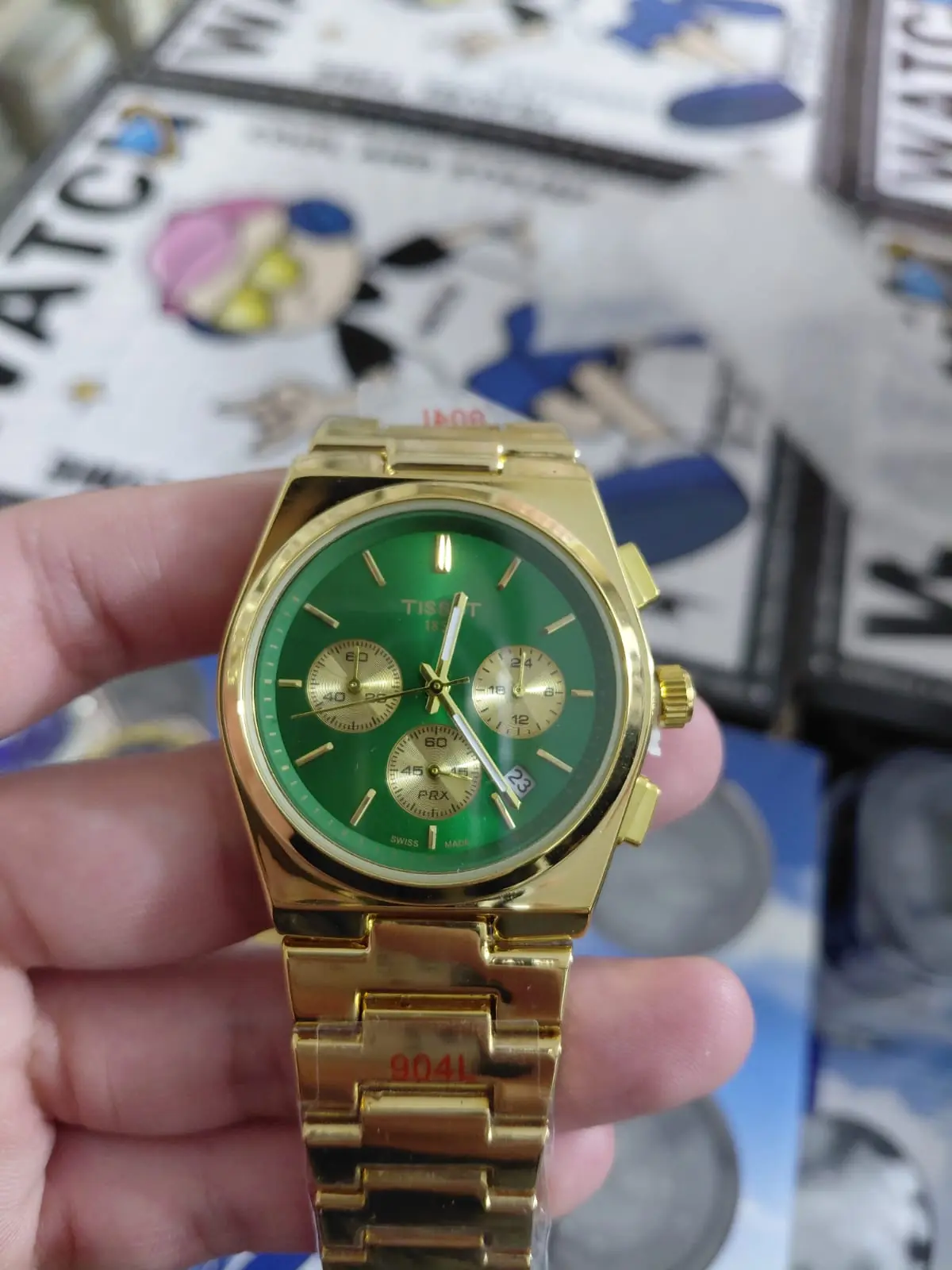 Tissot PRX Quartz Chronograph gold-tone watch with a green sunray dial
