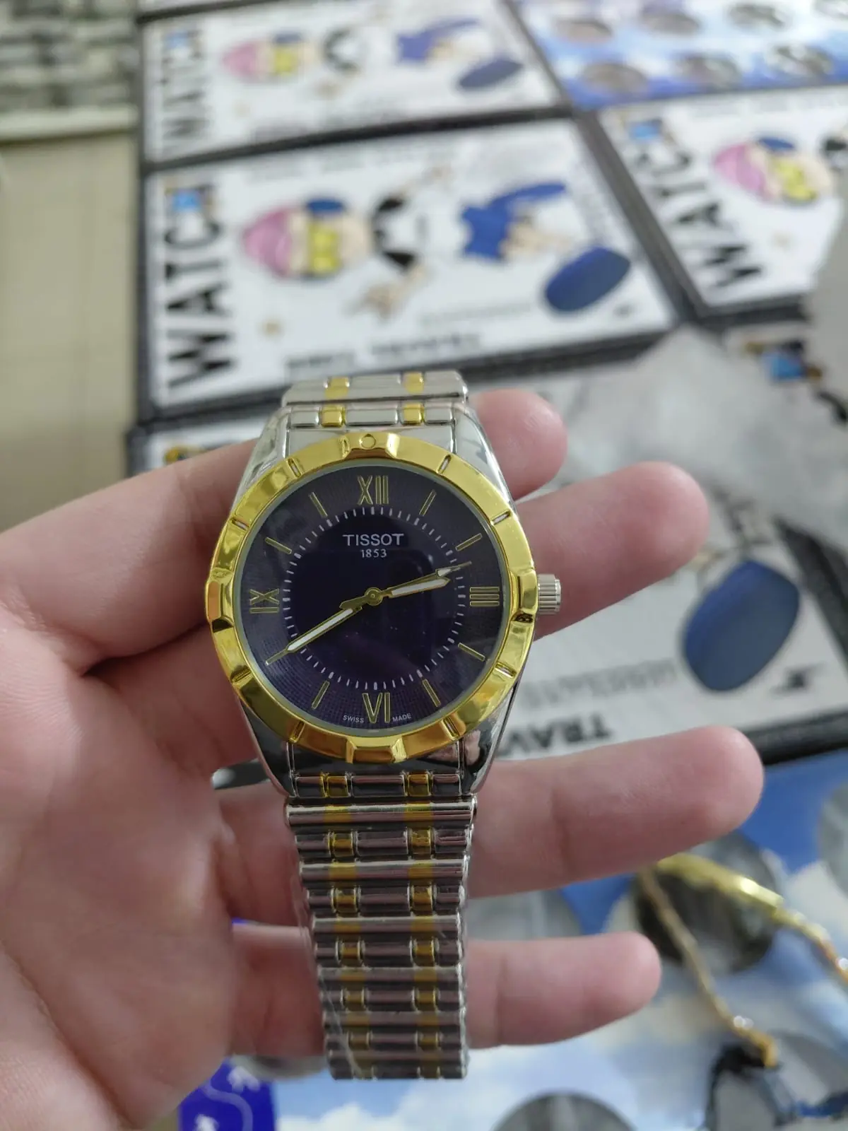 Tissot T-Lady two-tone gold-plated stainless steel watch with a dark blue dial