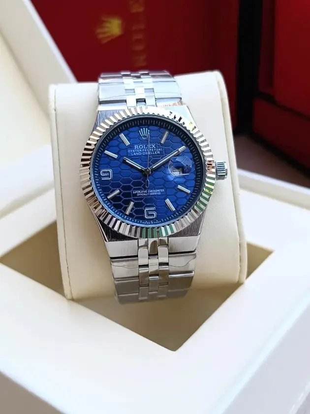 Rolex Oyster Perpetual Land-Dweller with a blue honeycomb dial and a fluted bezel