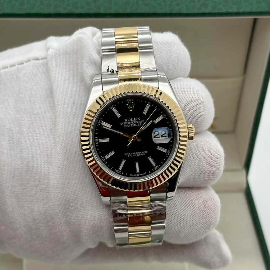 Rolex Datejust 41 with a black dial, fluted bezel, and two-tone steel and yellow gold Oyster bracelet