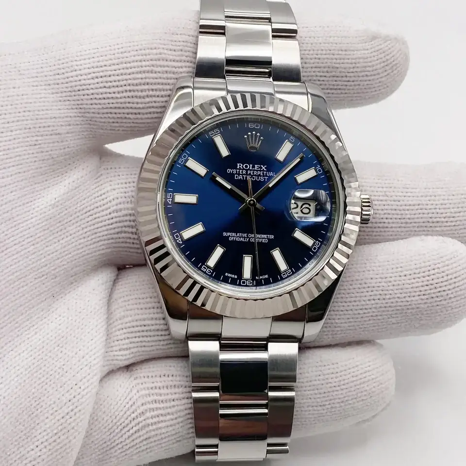 Rolex Datejust watch with a blue dial, fluted bezel, and a bracelet